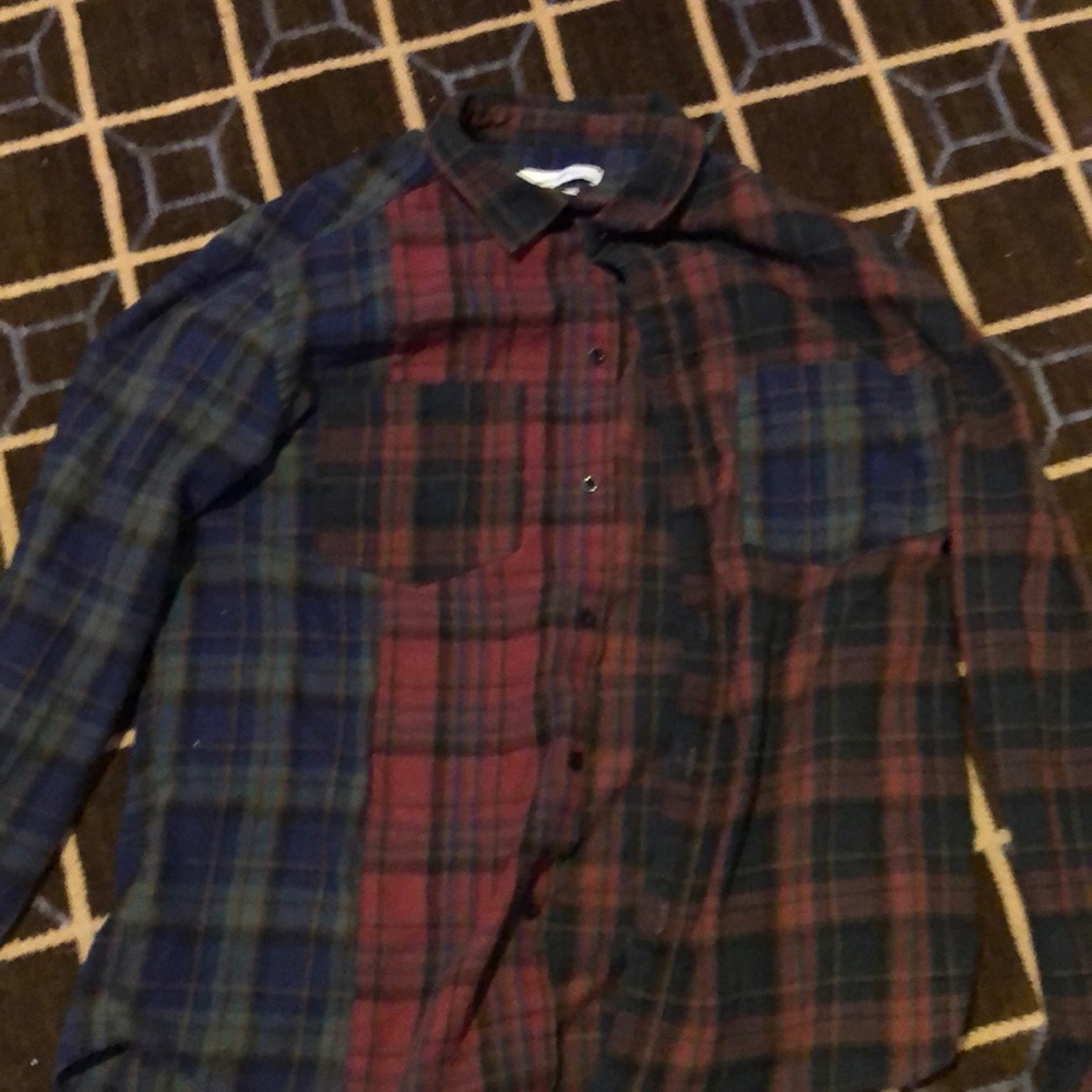 Used. Maroon, navy, dark green, and beige flannel.